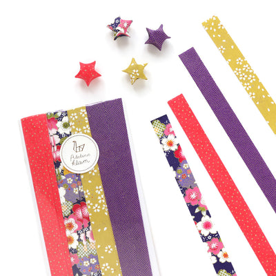 packaging du kit d'étoiles en origami et papier japonais roses, violets et jaune moutarde « kokeshi» adeline klam