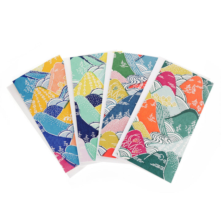 photo packshot en éventail des cartes doubles allongées tapissées de papier japonais aux motifs de montagnes et de rivières M966, M967, M969 et M965 adeline klam
