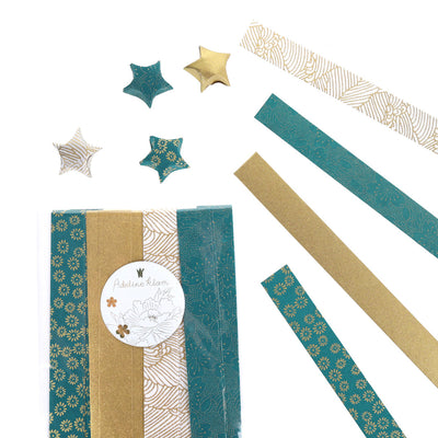 photo packshot du packaging et étoiles montées du kit étoiles en origami « orient » dans les tons bleu canard, dorés et blanc adeline klam