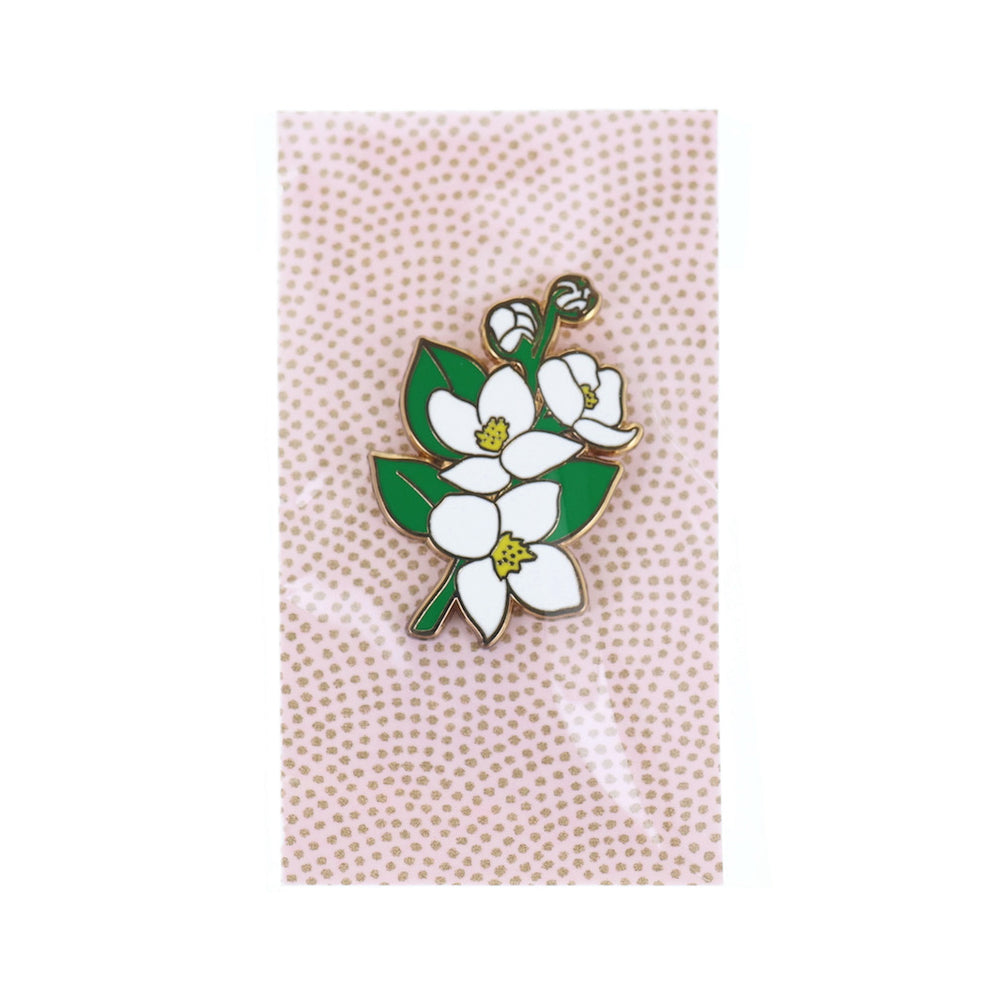 photo packshot du packaging du pin's en forme de fleurs de cornouiller du Japon blanche, jaune et verte