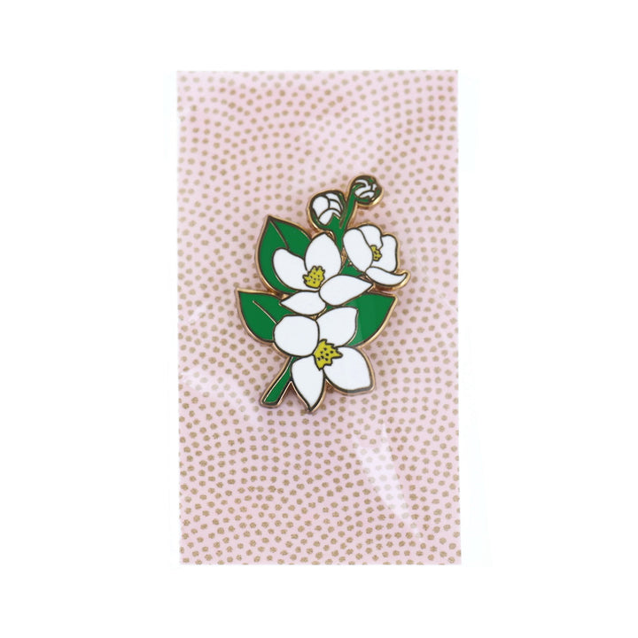 photo packshot du packaging du pin's en forme de fleurs de cornouiller du Japon blanche, jaune et verte