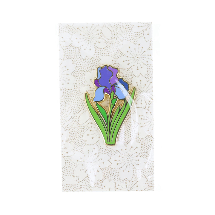 photo packshot du packaging du pin's en forme de fleurs d'iris bleue, violette et verte