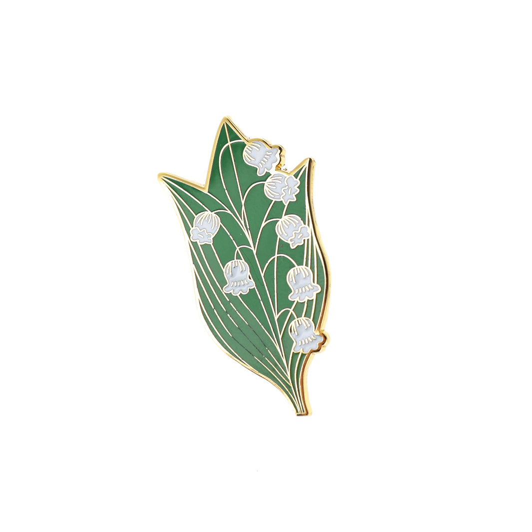 photo packshot du pin's en forme de brin de muguet blanc et vert