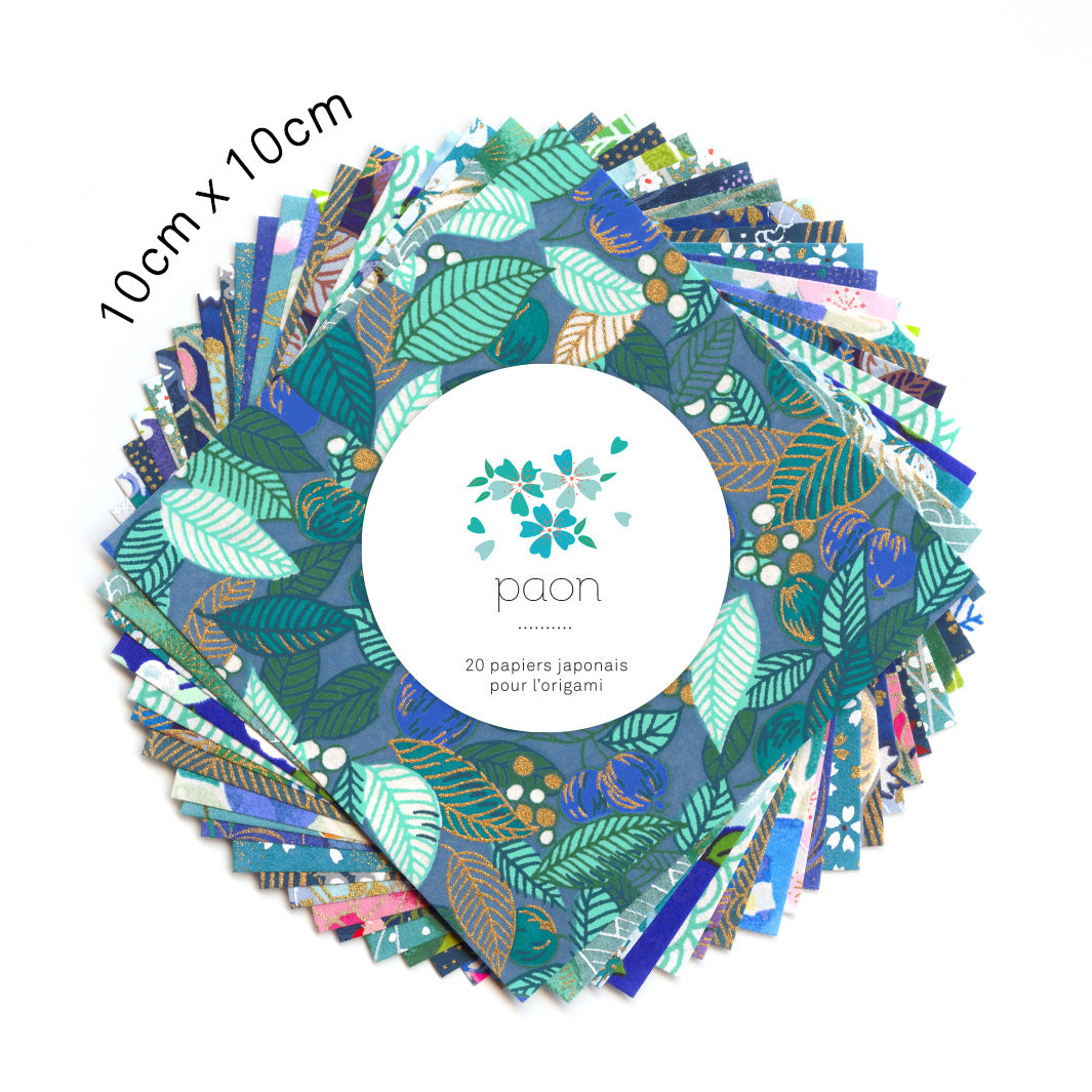 photo packshot du set de 20 carrés de papiers japonais adeline klam de 10cm par 10cm dans les tons bleu canard, vert d'eau, bleu nuit, turquoise et violets « paon »