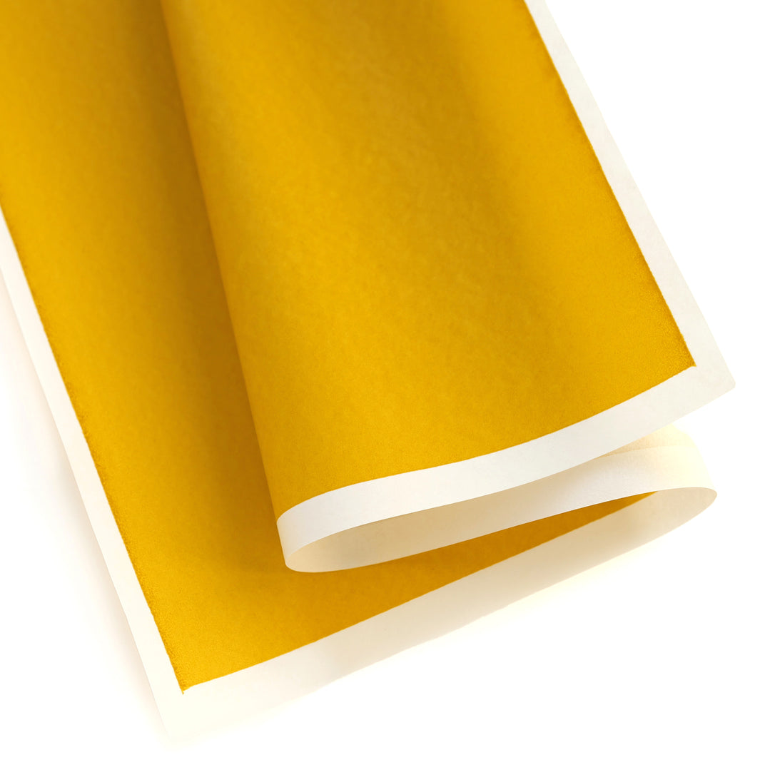 photo packshot d'une courbe du papier japonais yuzen chiyogami uni jaune curry adeline klam (U1046)