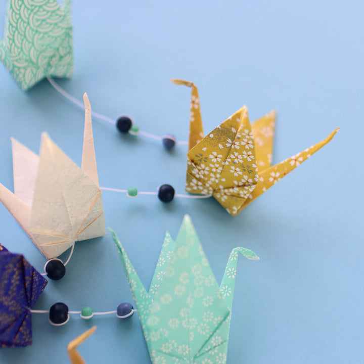 détail de la photo d'ambiance de l'atelier guirlande de grues