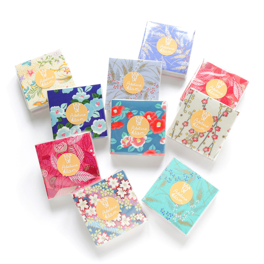 packaging d'un set de 100 papiers origami en 6cm par 6cm « boréal » aux motifs et tons variés