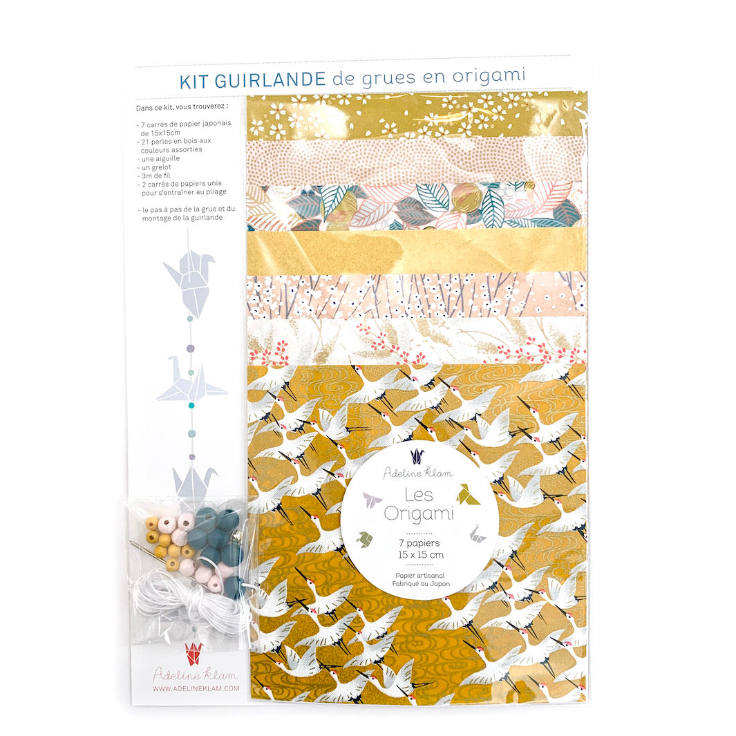 packshot du kit guirlande de grues en origami « savane » dans les tons jaune moutarde, rose clair et blancs