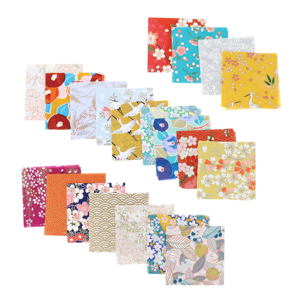 photo packshot de l'assortiment de papiers japonais du set de 100 carrés de papiers japonais adeline klam de 6cm par 6cm dans les tons jaunes, orange, rouges, roses et bleu turquoise « multifruits »
