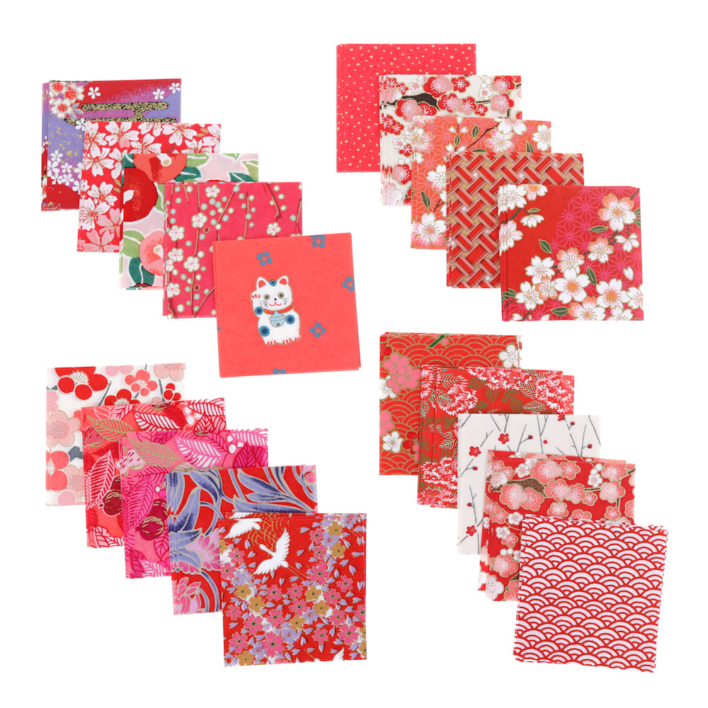 photo packshot de l'assortiment de papiers japonais du set de 100 carrés de papiers japonais adeline klam de 6cm par 6cm dans les tons rouges, rouge orangé, corail et roses « grenadine »