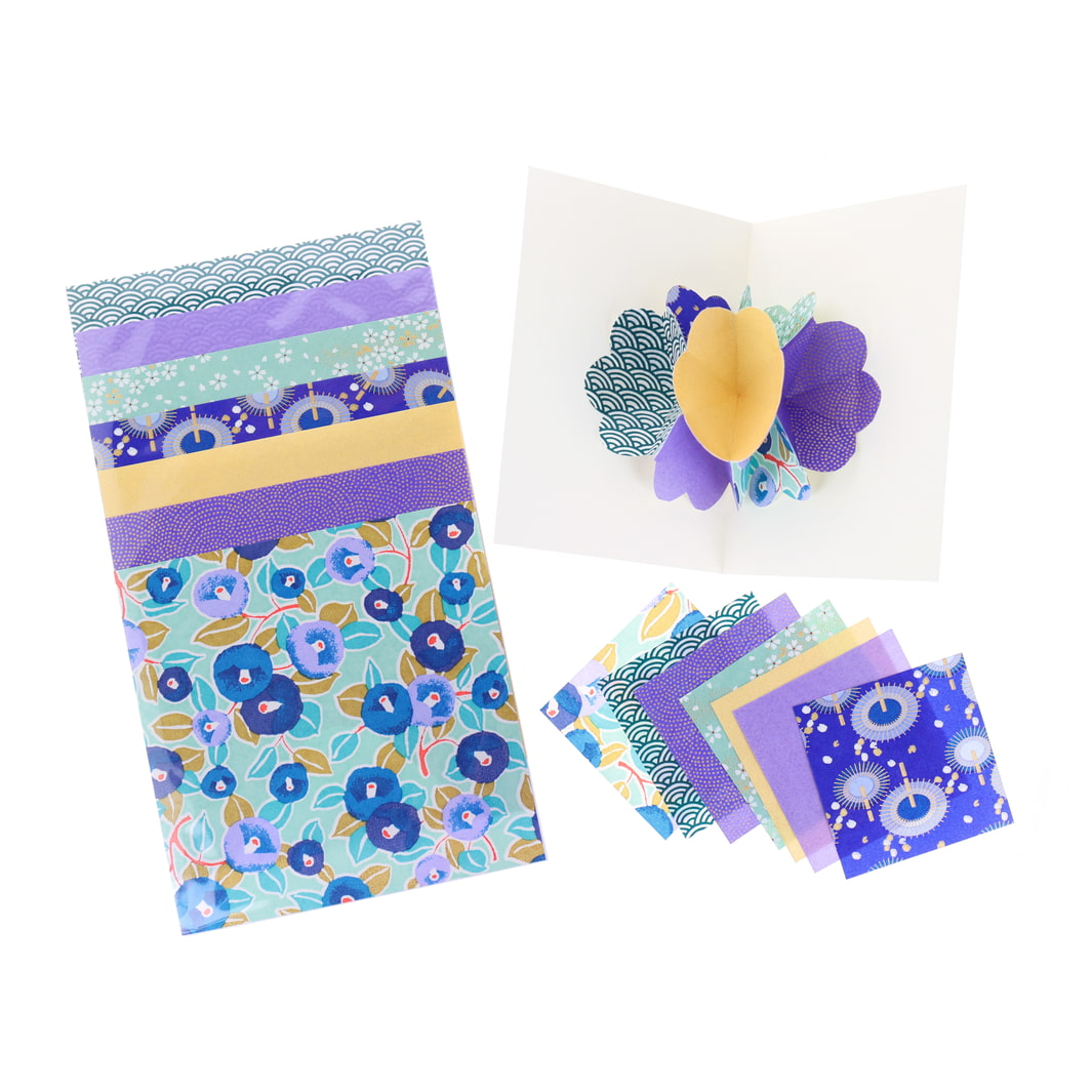 photo packshot d'une carte montée et des papiers japonais du kit 4 cartes pop-up dans les tons vert d'eau, bleu foncé, violets et dorés « fraîcheur » adeline klam