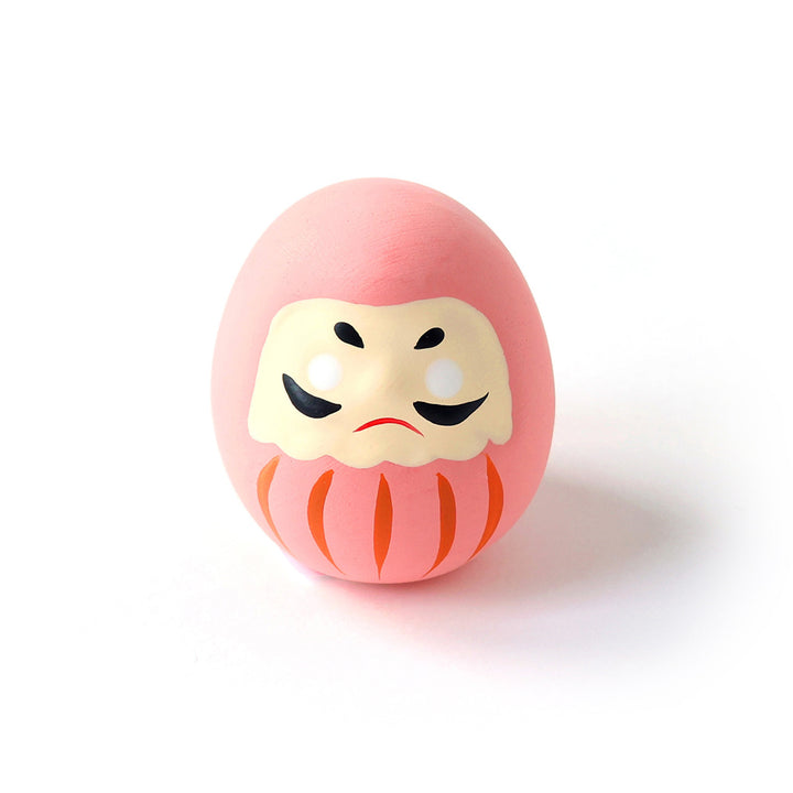 photo packshot d'un daruma en céramique rose