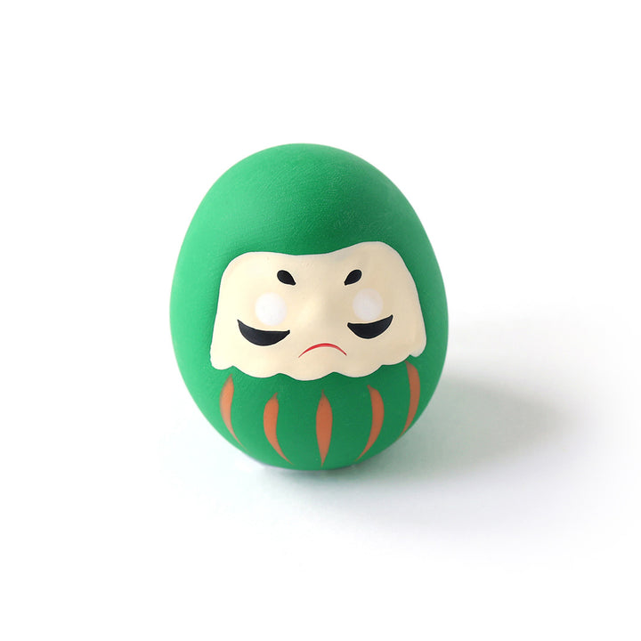 photo packshot d'un daruma en céramique verte