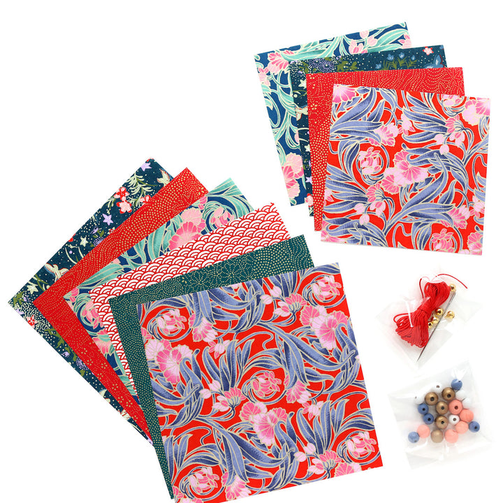 photo packshot d'un détail du matériel du kit pampilles rouge, bleu marine, bleu canard et rose « baroque » adeline klam