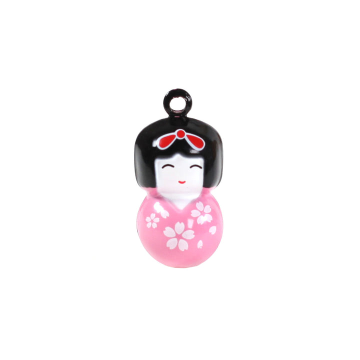 photo packshot d'un grelot en forme de kokeshi rose