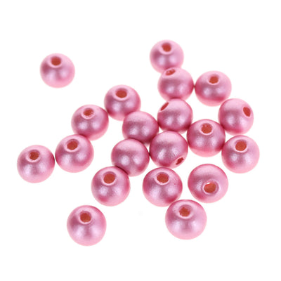 photo packshot d'un lot de 20 perles en bois métallisée de 10mm de diamètre de couleur rose moyen