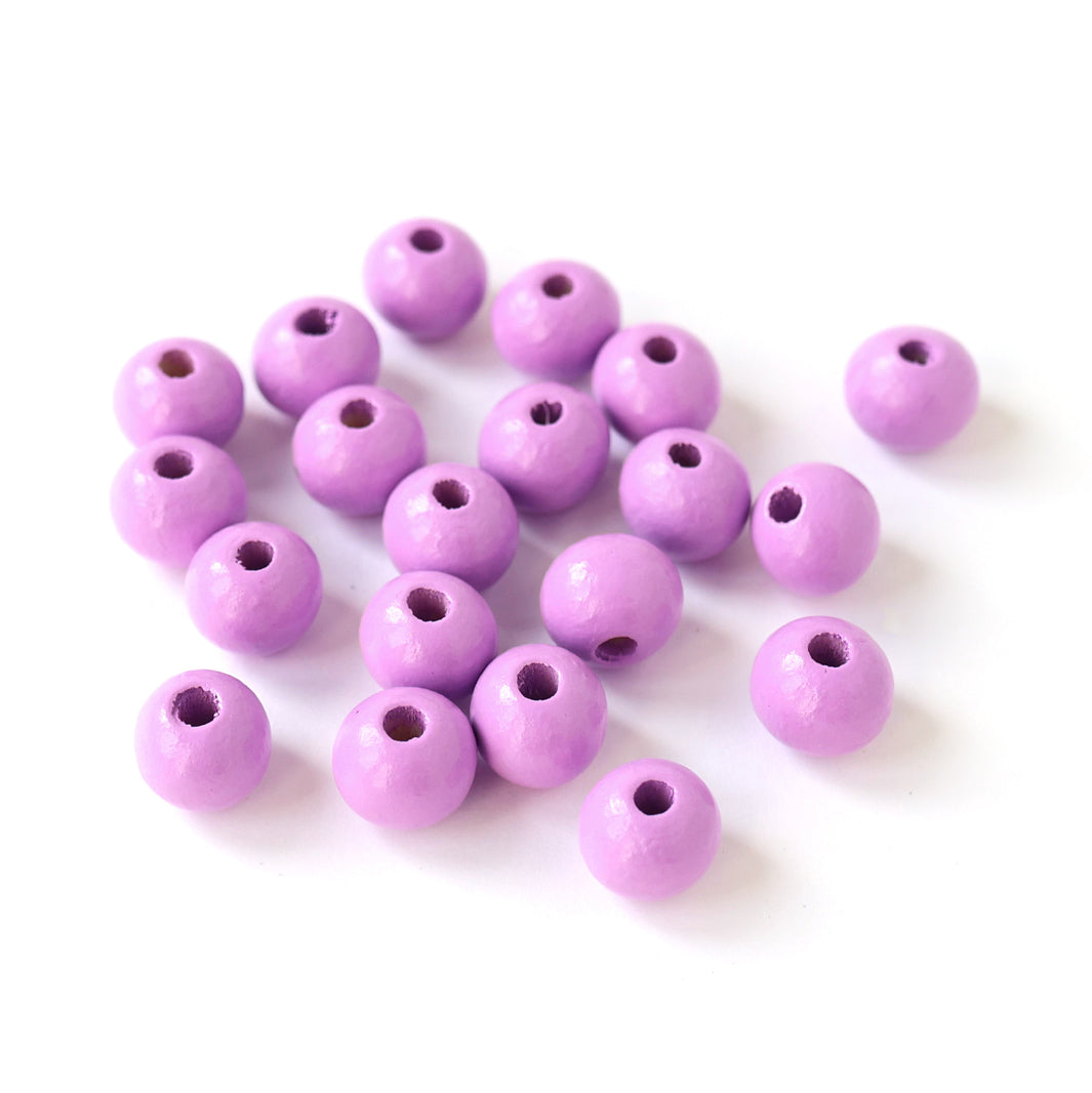 photo packshot d'un lot de 20 perles en bois métallisée de 10mm de diamètre de couleur violet lilas
