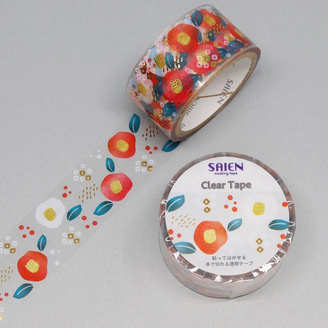 photo packshot d'un masking tape transparent au motifs de camélias dans les tons rouges, bleus, blancs et dorés