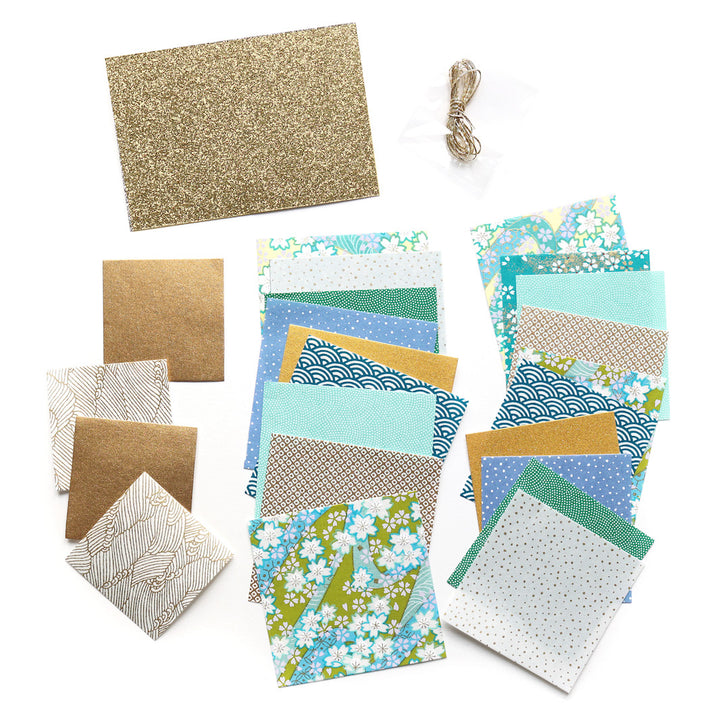 photo packshot du matériel du kit sapins à suspendre dans les tons bleus, verts et dorés « forêt » adeline klam