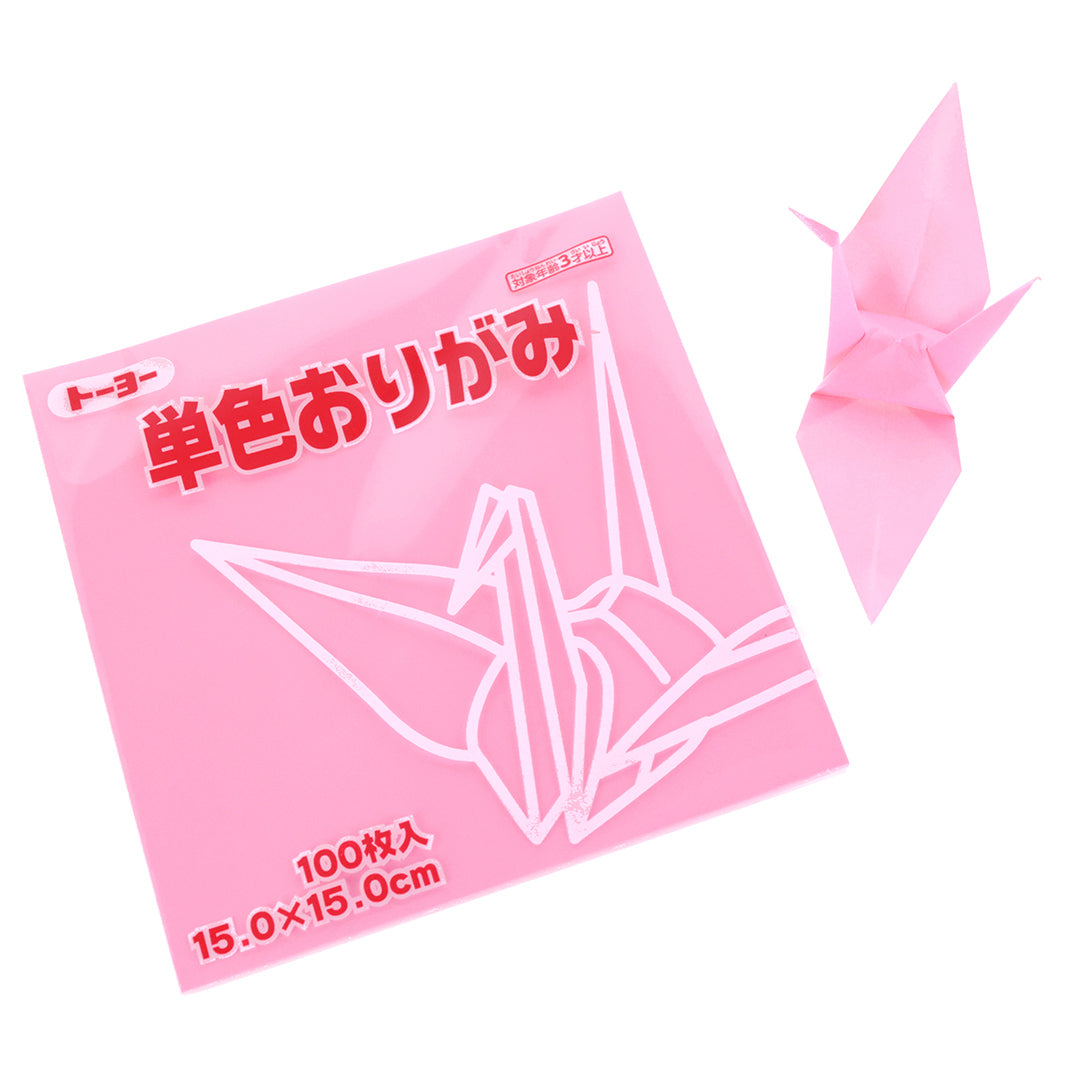 photo packshot du packaging et d'une grue montée du set de 100 papiers origami unis rose flamingo toyo
