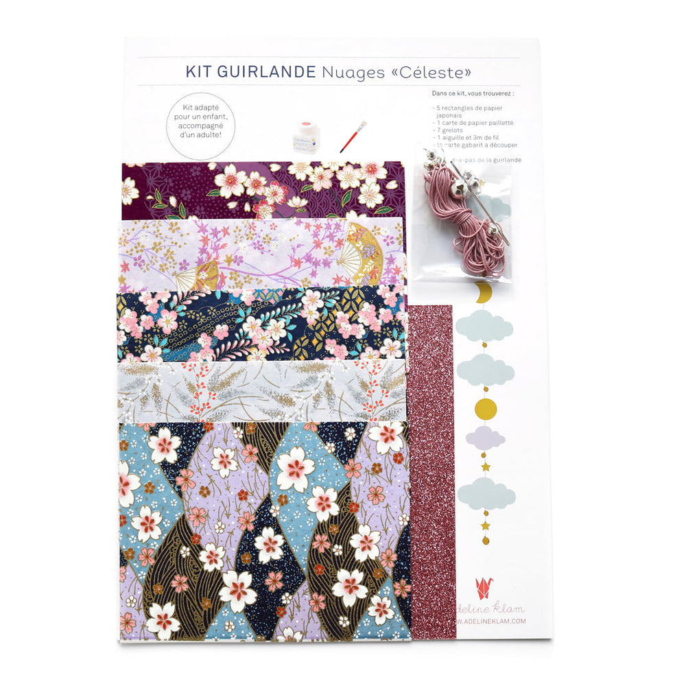 photo packshot du packaging du kit guirlande de nuages « céleste » dans les tons mauve, lilas, bleu marine et bleu clair « pimprenelle » adeline klam