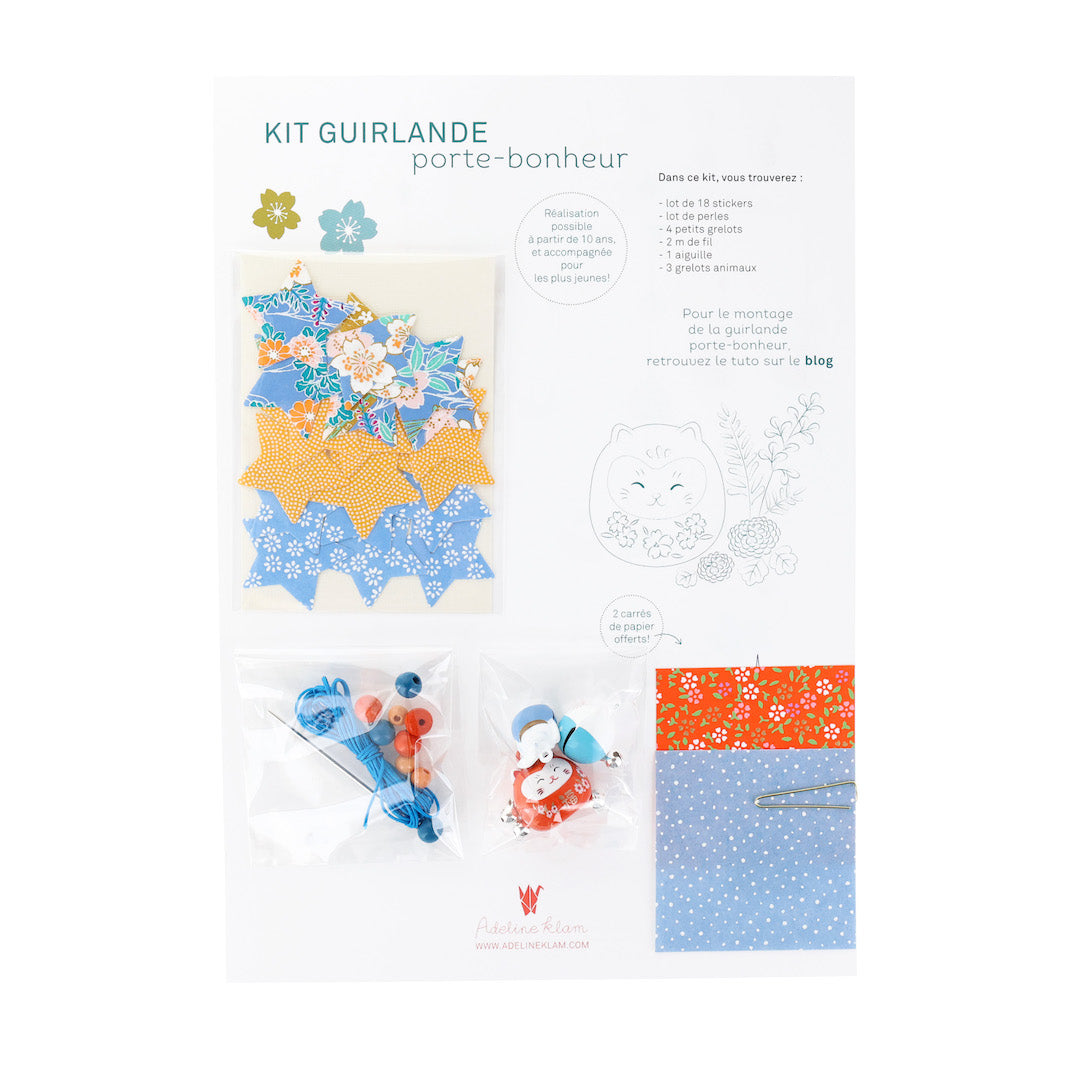 photo packshot du packaging du kit guirlande porte-bonheur bleu pervenche, jaune safran et rouge orangé « louisiane » adeline klam