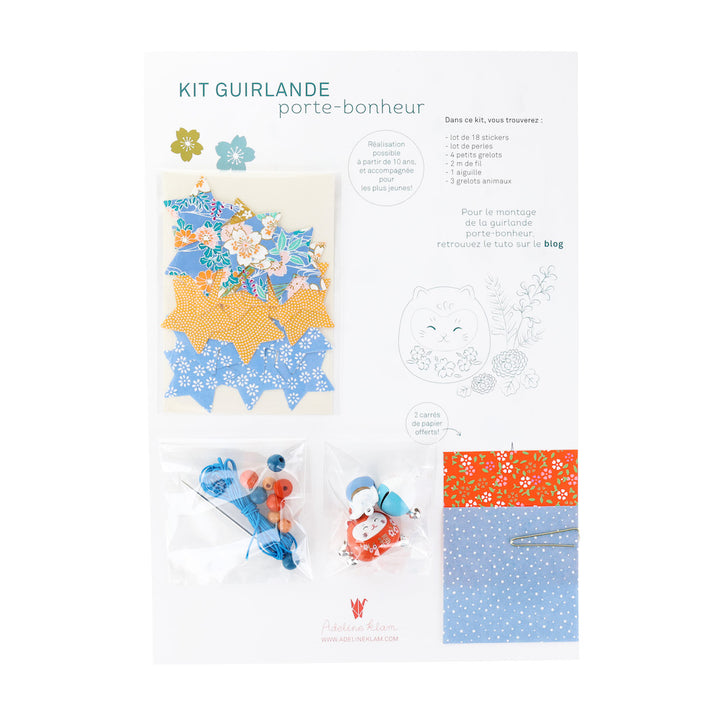 photo packshot du packaging du kit guirlande porte-bonheur bleu pervenche, jaune safran et rouge orangé « louisiane » adeline klam