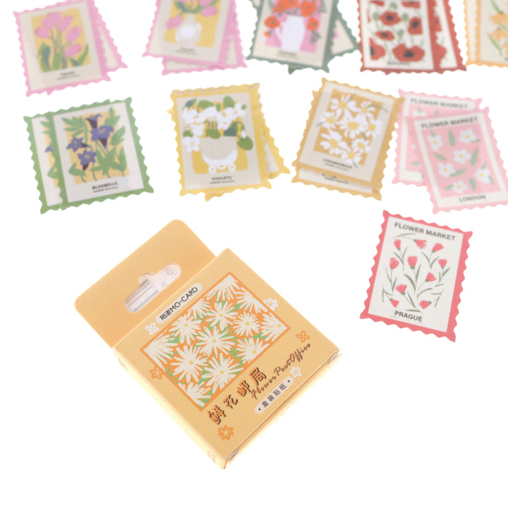 photo packshot du packaging du lot de 46 stickers en forme de timbres floraux multicolores