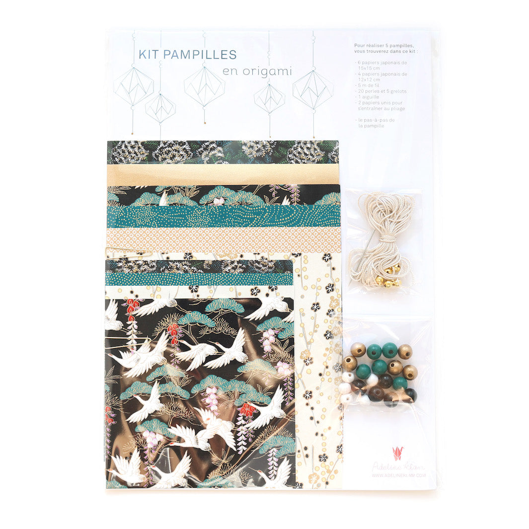 photo packshot du packaging du kit pampilles « chaplin » dans les tons noirs, dorés et bleu canard adeline klam