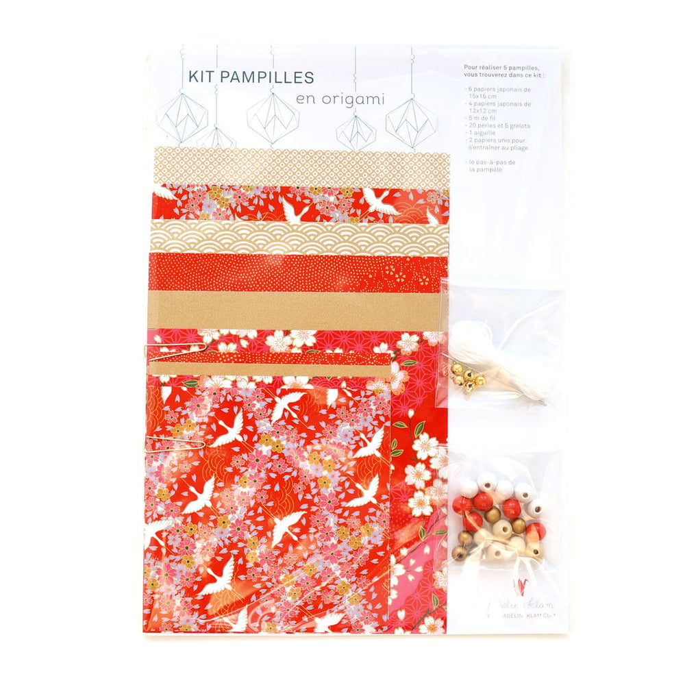 photo packshot du packaging du kit pampilles « rubis » dans les tons rouges, blancs et dorés adeline klam