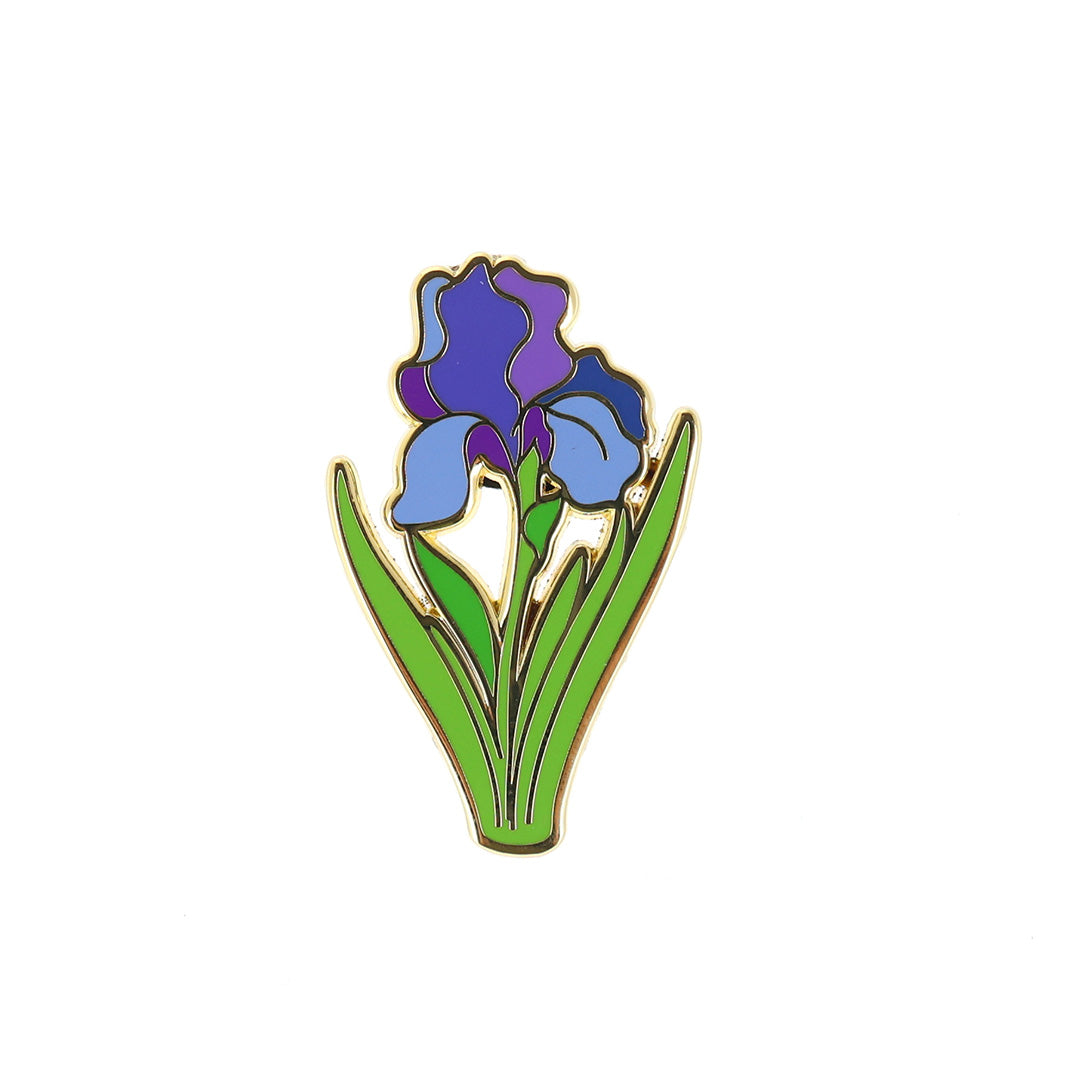 photo packshot du pin's en forme de fleurs d'iris bleue, violette et verte