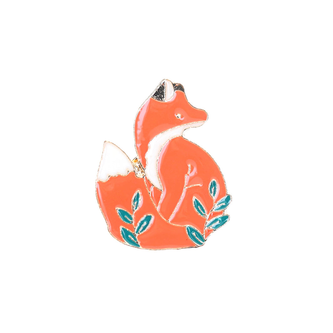 photo packshot du recto du pin's en forme de renard orange et de feuillages verts
