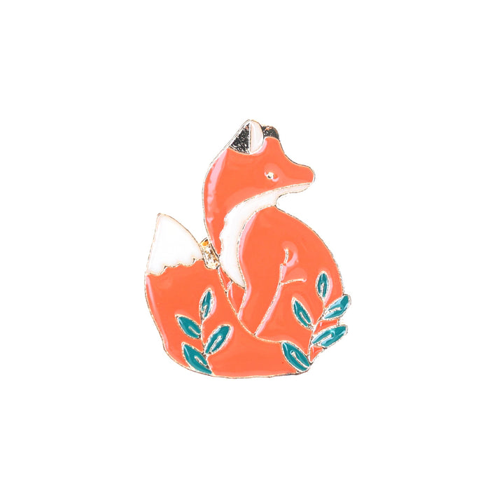photo packshot du recto du pin's en forme de renard orange et de feuillages verts