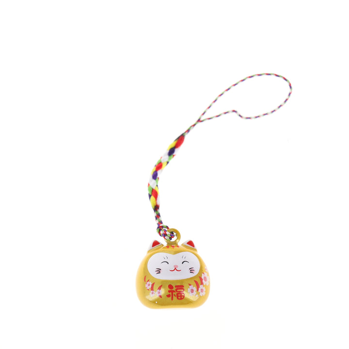 photo packshot d'un porte-clefs en forme de daruma et de chat de couleur jaune nacré