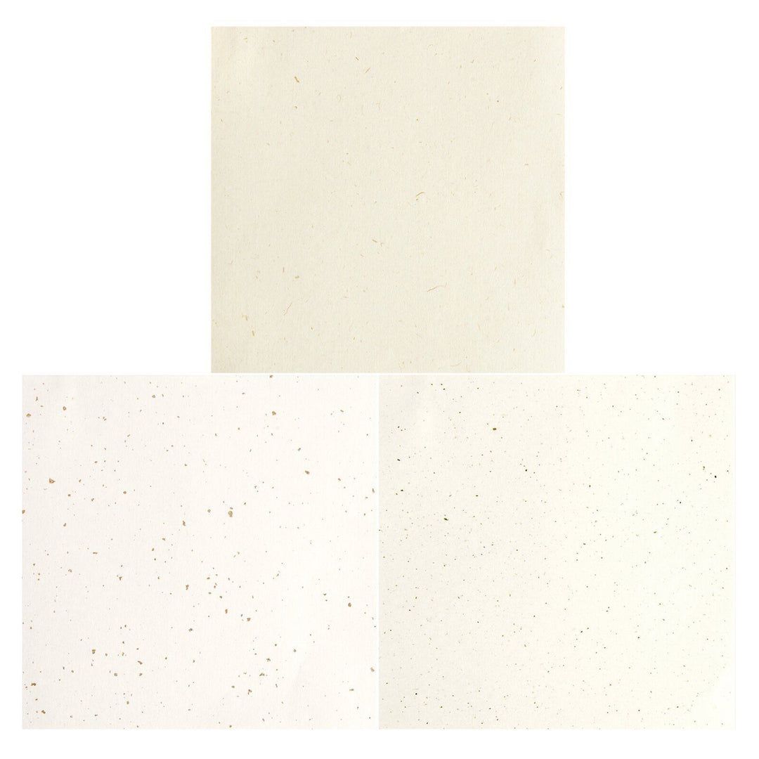 photo packshot de la sélection de papiers du set de 30 papiers origami unis mouchetés blancs, beiges et ivoires de 15cm par 15cm rico design