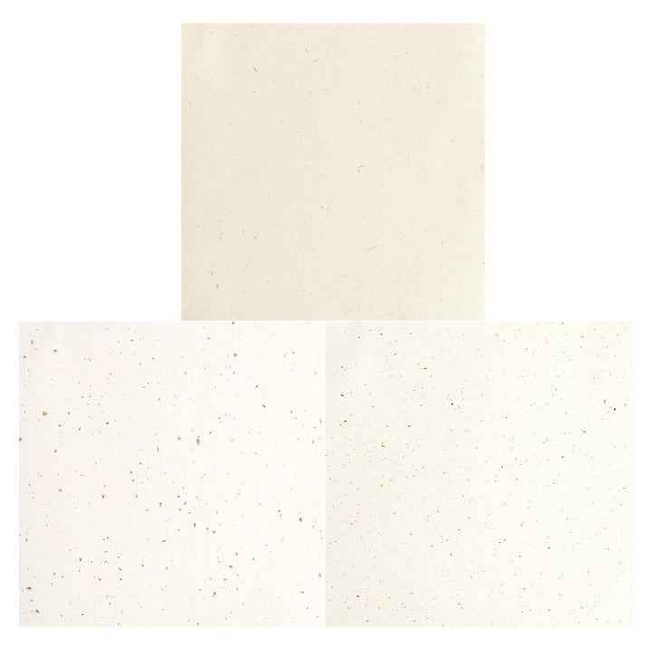 photo packshot de la sélection de papiers du set de 30 papiers origami unis mouchetés blancs, beiges et ivoires de 15cm par 15cm rico design
