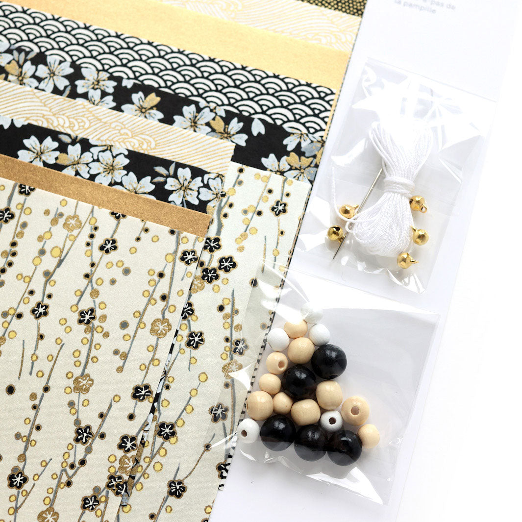 photo packshot zoomée d'un détail du matériel du kit pampilles noir, blanc crème et doré « gatsby » adeline klam