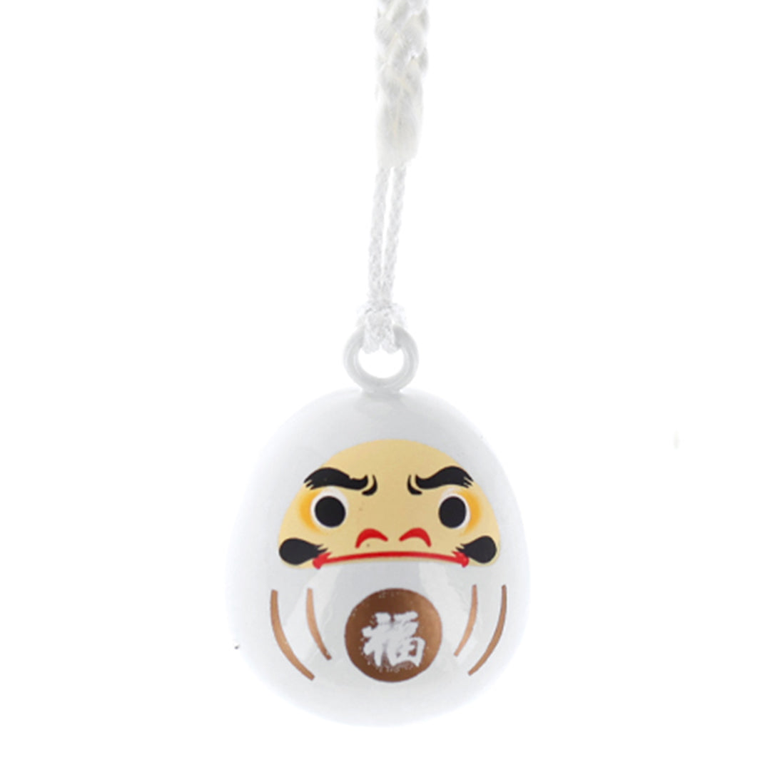 photo packshot zoomée d'un porte-clefs en forme de daruma de couleur blanche