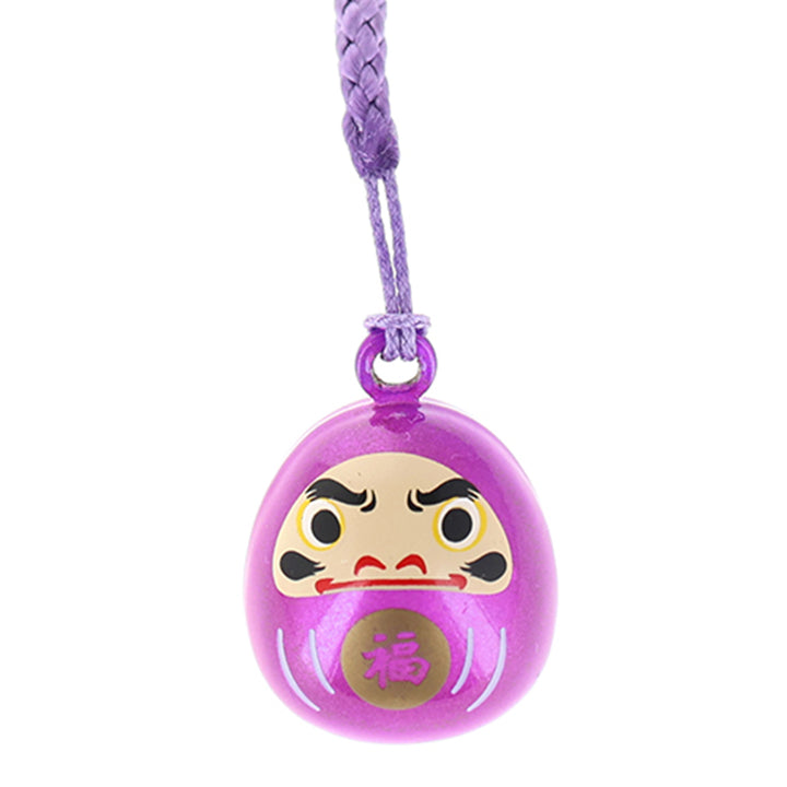 photo packshot zoomée d'un porte-clefs en forme de daruma de couleur violet prune nacré
