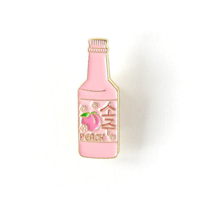 pin's en forme de bouteille de limonade à la pêche rose