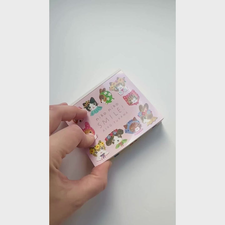 video du bloc-notes de 120 feuilles « niko niko smile » par Aiko Fukawa pour Cozyca Products