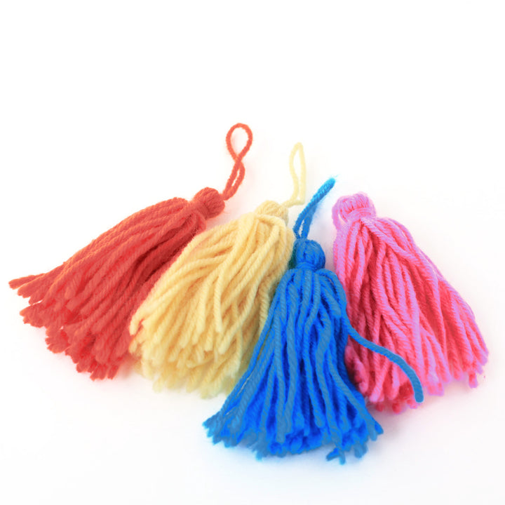 Set of 4 long hanging wool pompoms - Yellow, Pink, Red and Blue