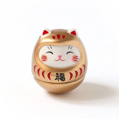 petit culbuto japonais ou koro-rin en forme de daruma chat doré de face