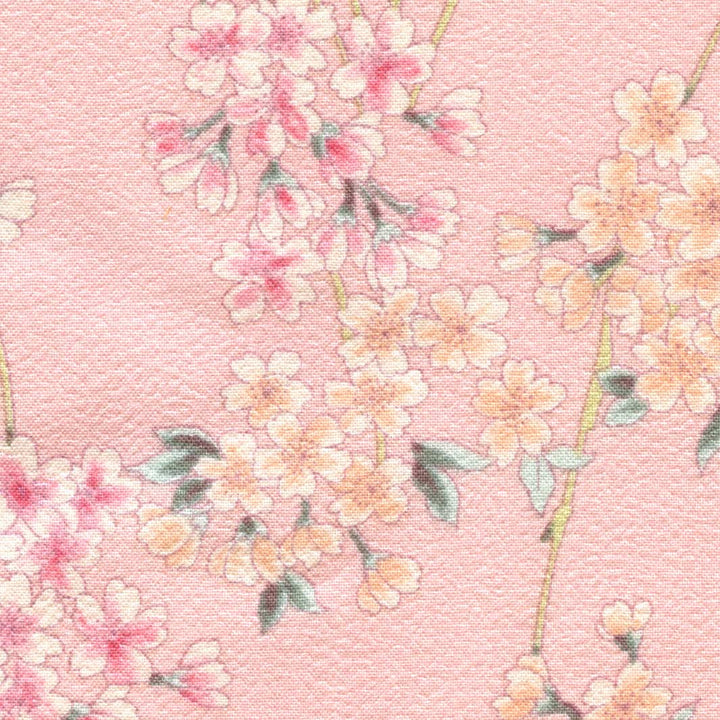 zoom de 10cm par 10cm d'un tissu japonais aux motifs de branches fines de fleurs de cerisier dans les tons roses, crèmes, pêche et vert adeline klam